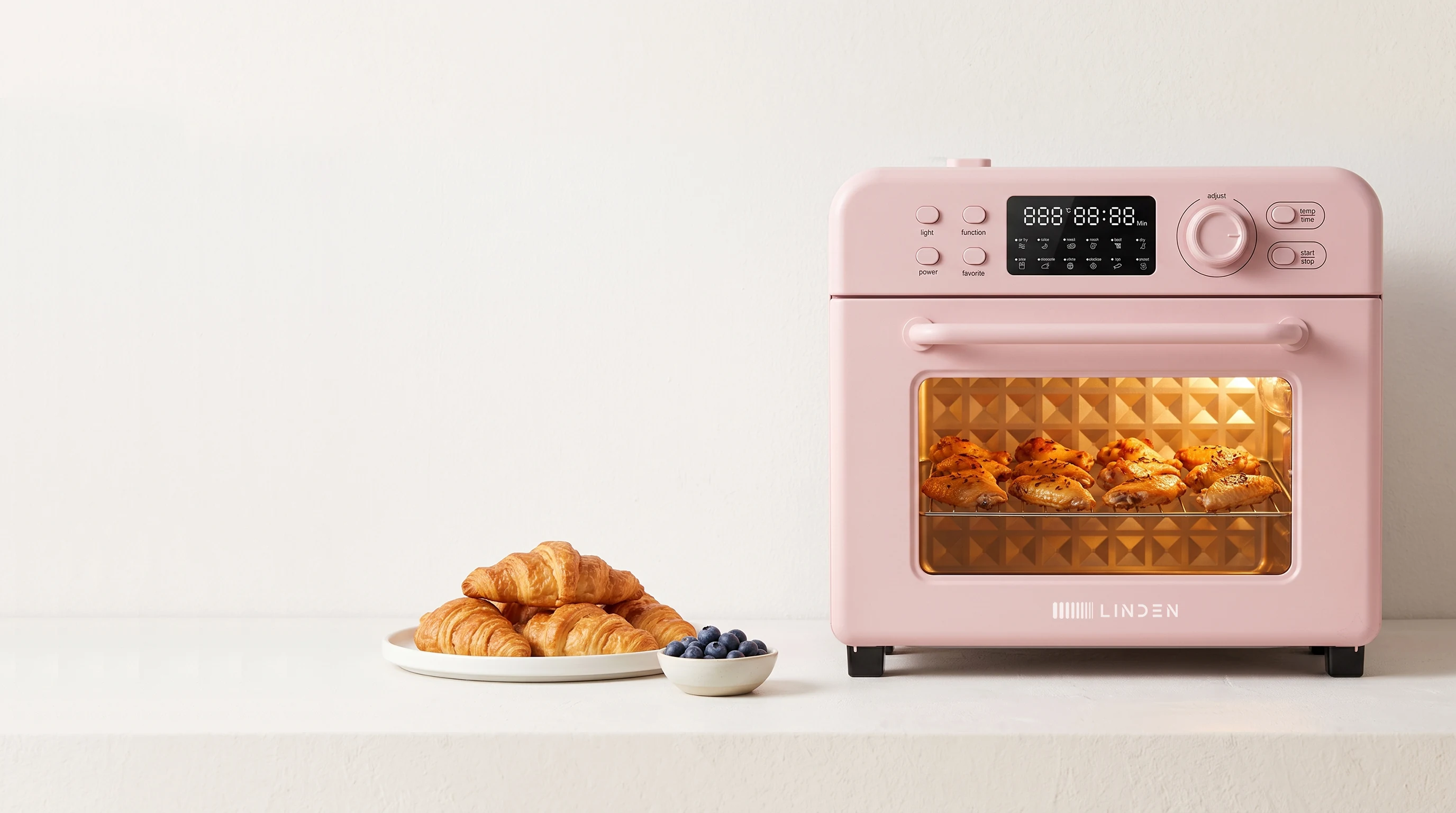 Rose countertop oven with baked food, representing factory-supported product configuration
